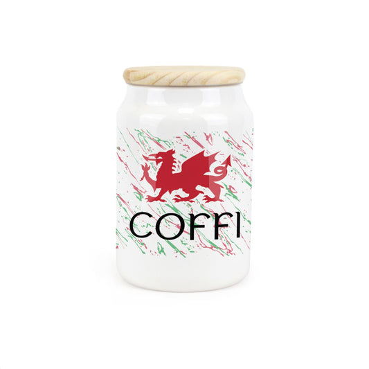 White ceramic canister featuring red Welsh dragon design.