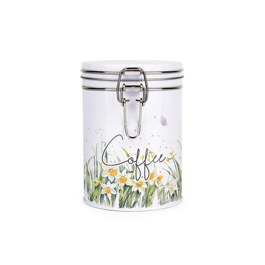 Metal canister with a metal clip and lid featuring a delicate daffodil print with butterflies and dragonflies and coffee text