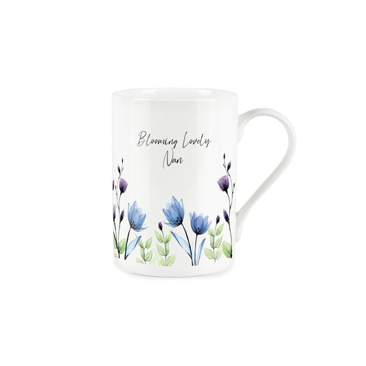 "Blooming Lovely nan" written in cursive text about delicate painted blue and purple flowers on a white bone china mug