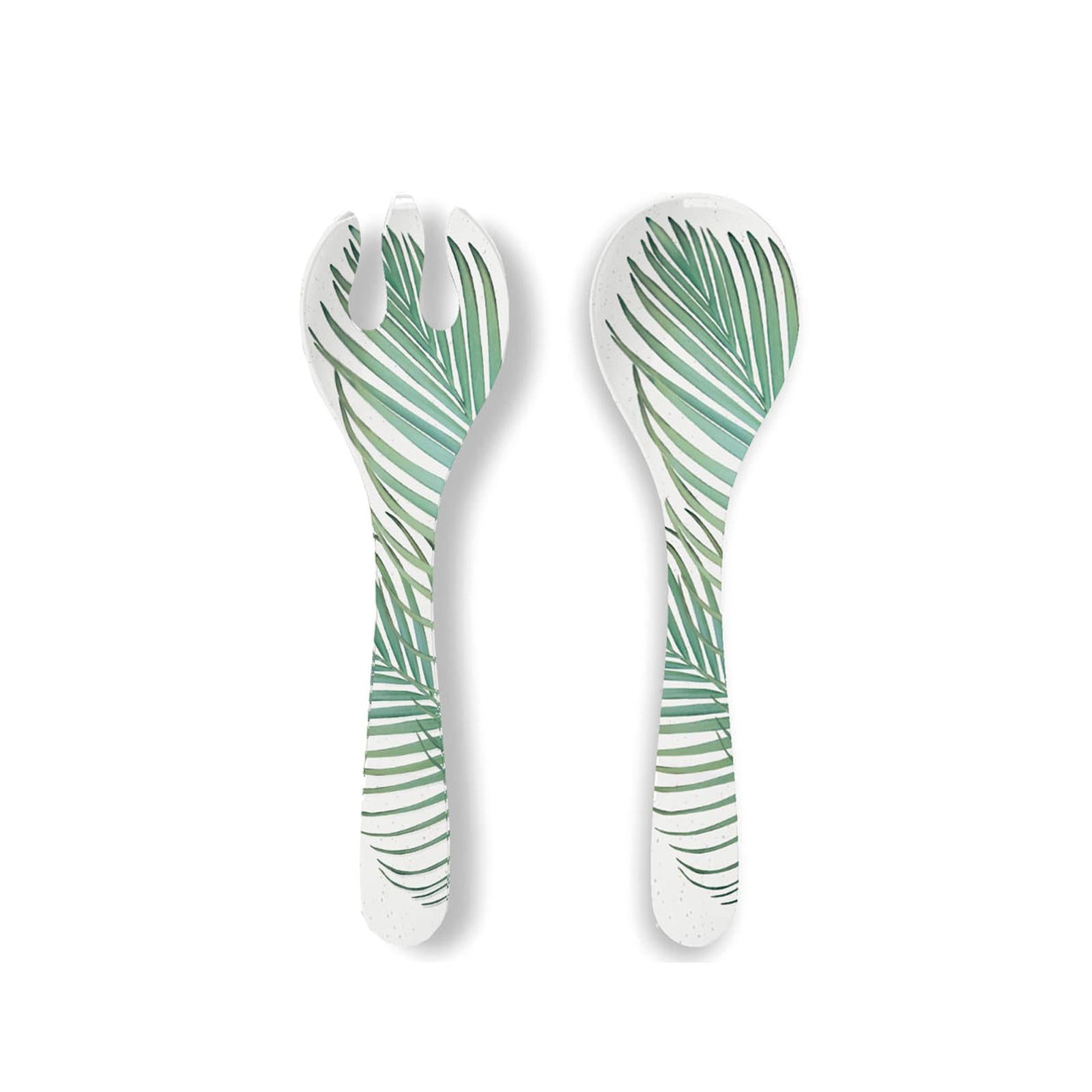 Set of white melamine salad server featuring green leaf patterns printed on surface
