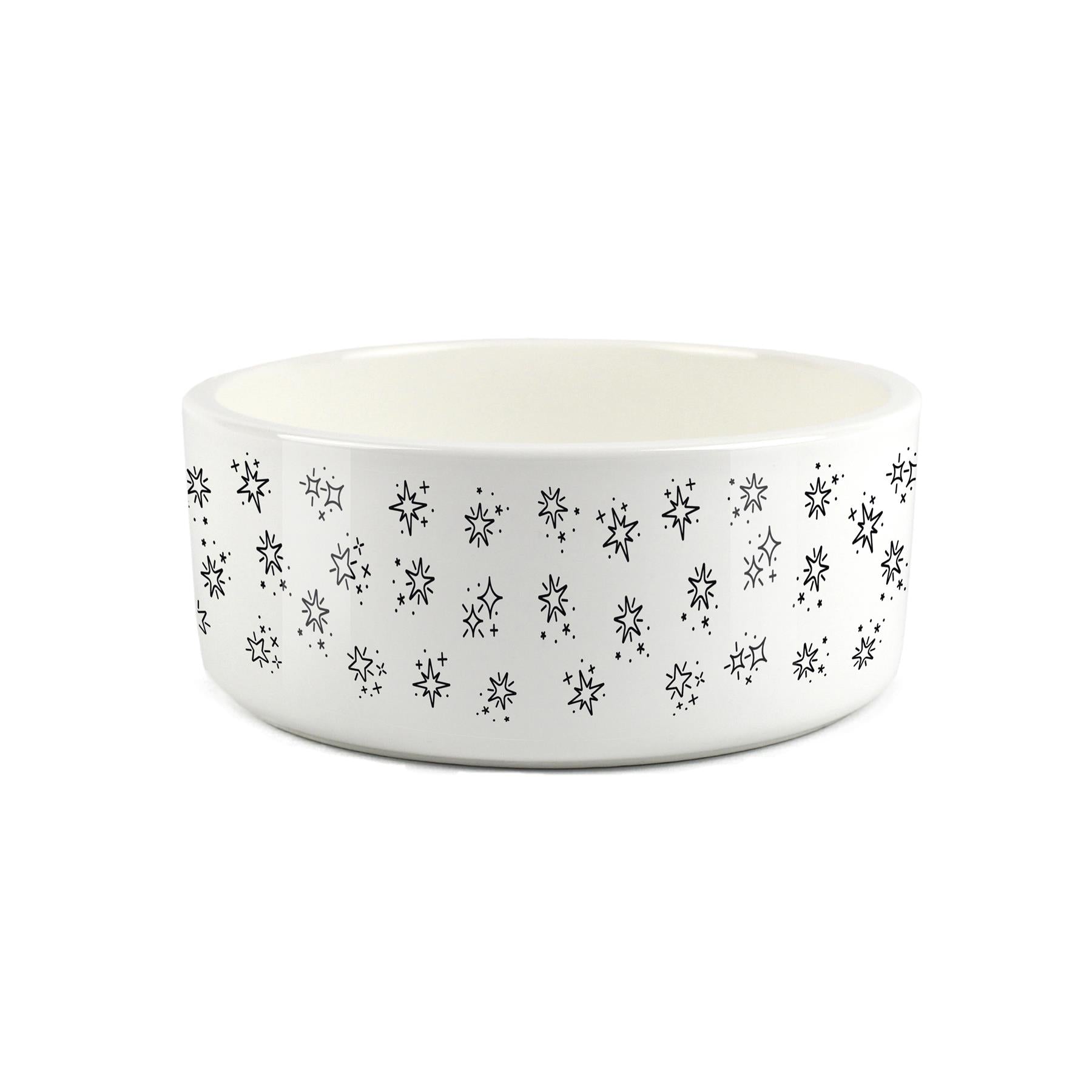 White ceramic pet bowl with printed star design on surface