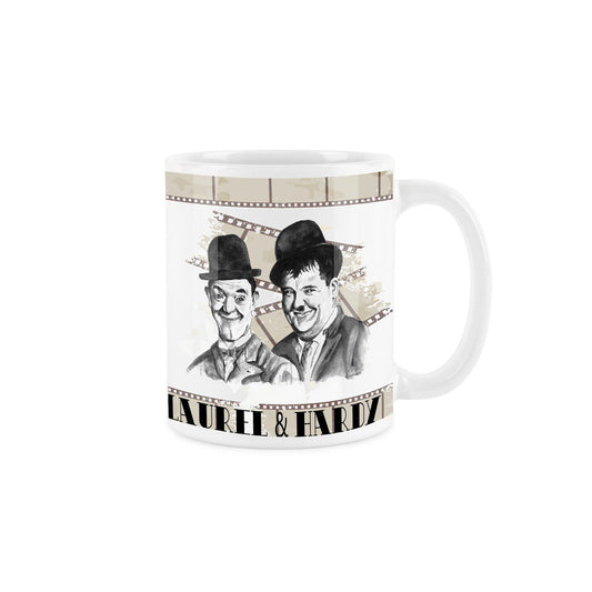 White ceramic mug featuring watercolour depiction of laurel & hardy on a background of tea coloured film reels