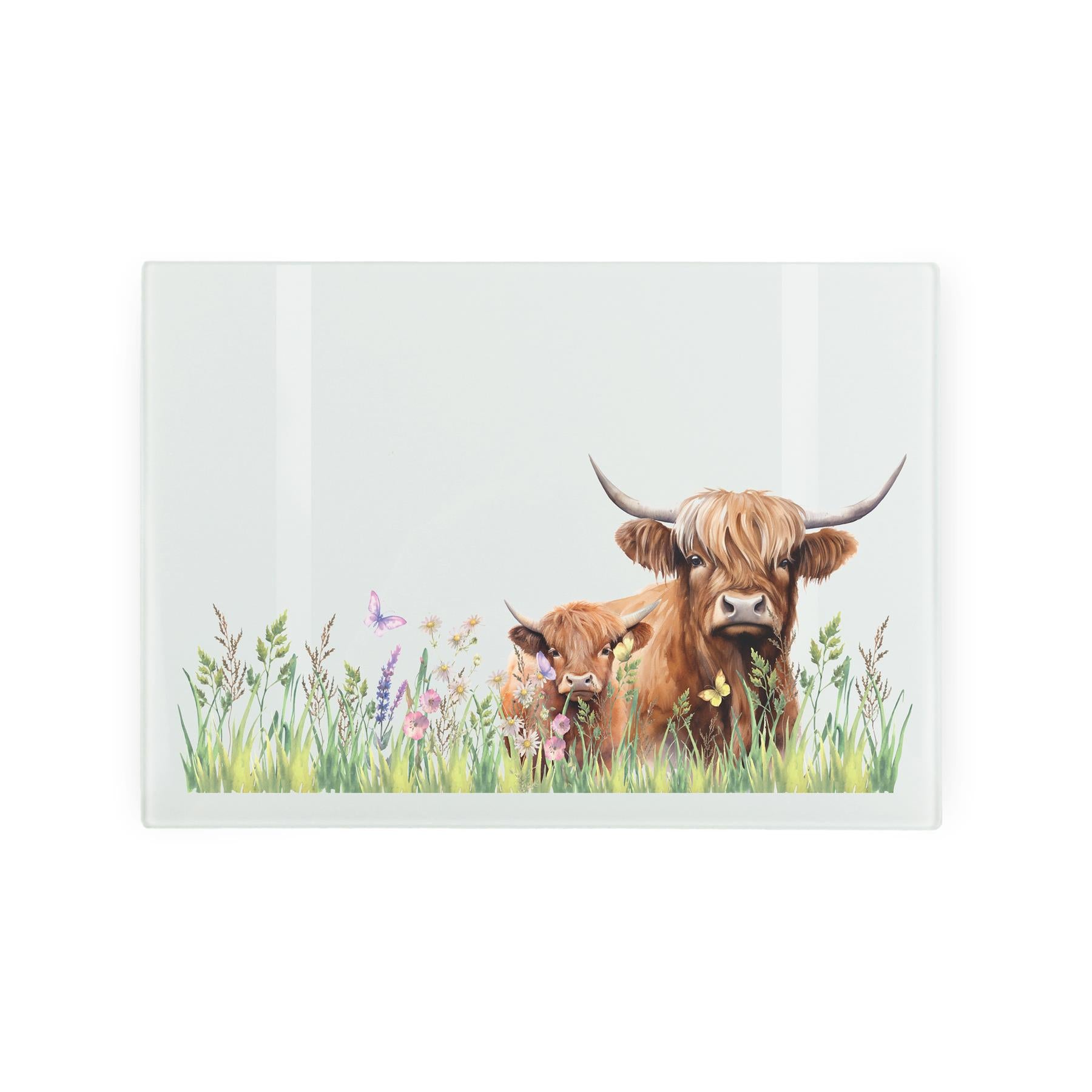 Glass worktop protector with Highland cow and meadow design.