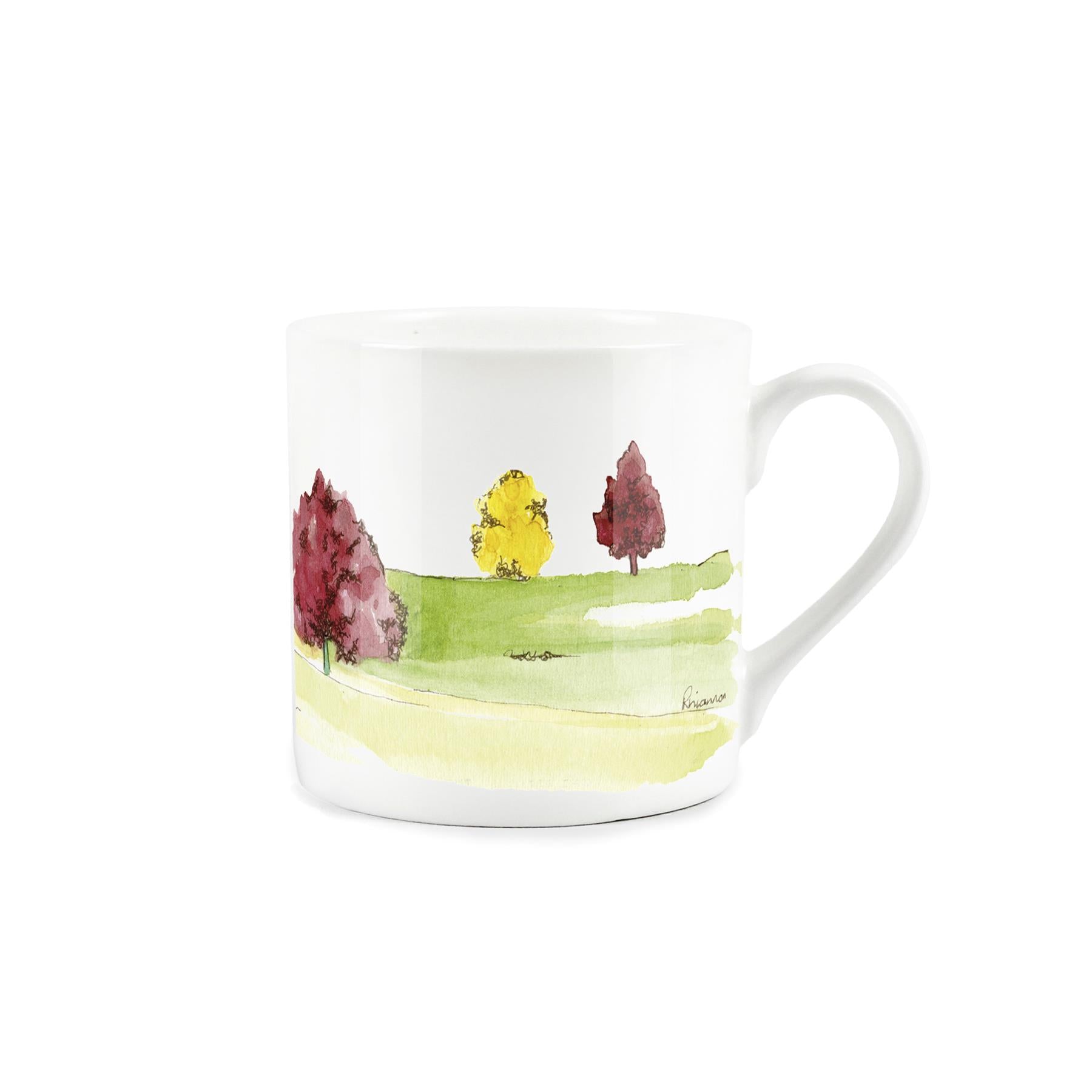 Bone china mug with watercolour artwork depicting oak trees within a pastoral english landscape