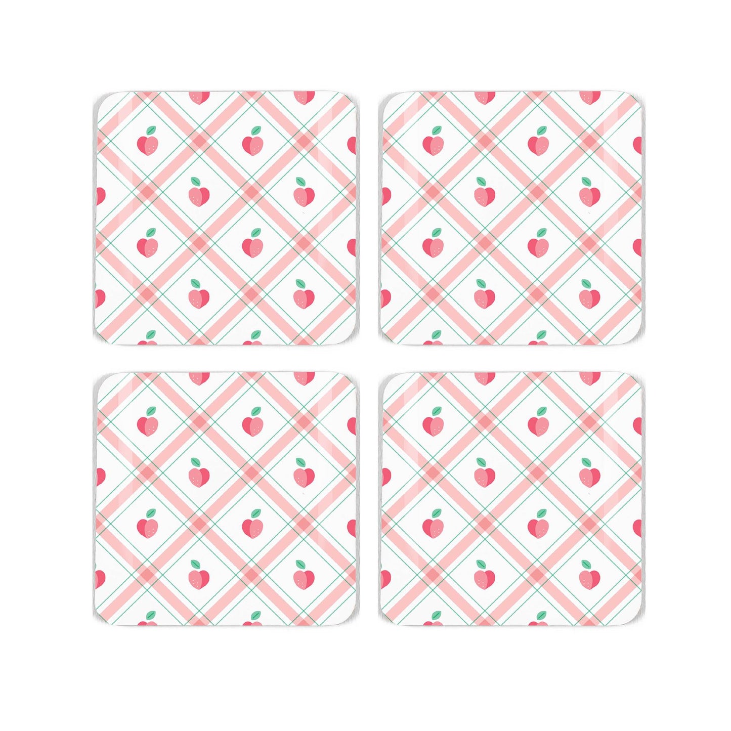 Four square cork coaster with a pretty gingham and peach, repeating design on a white background