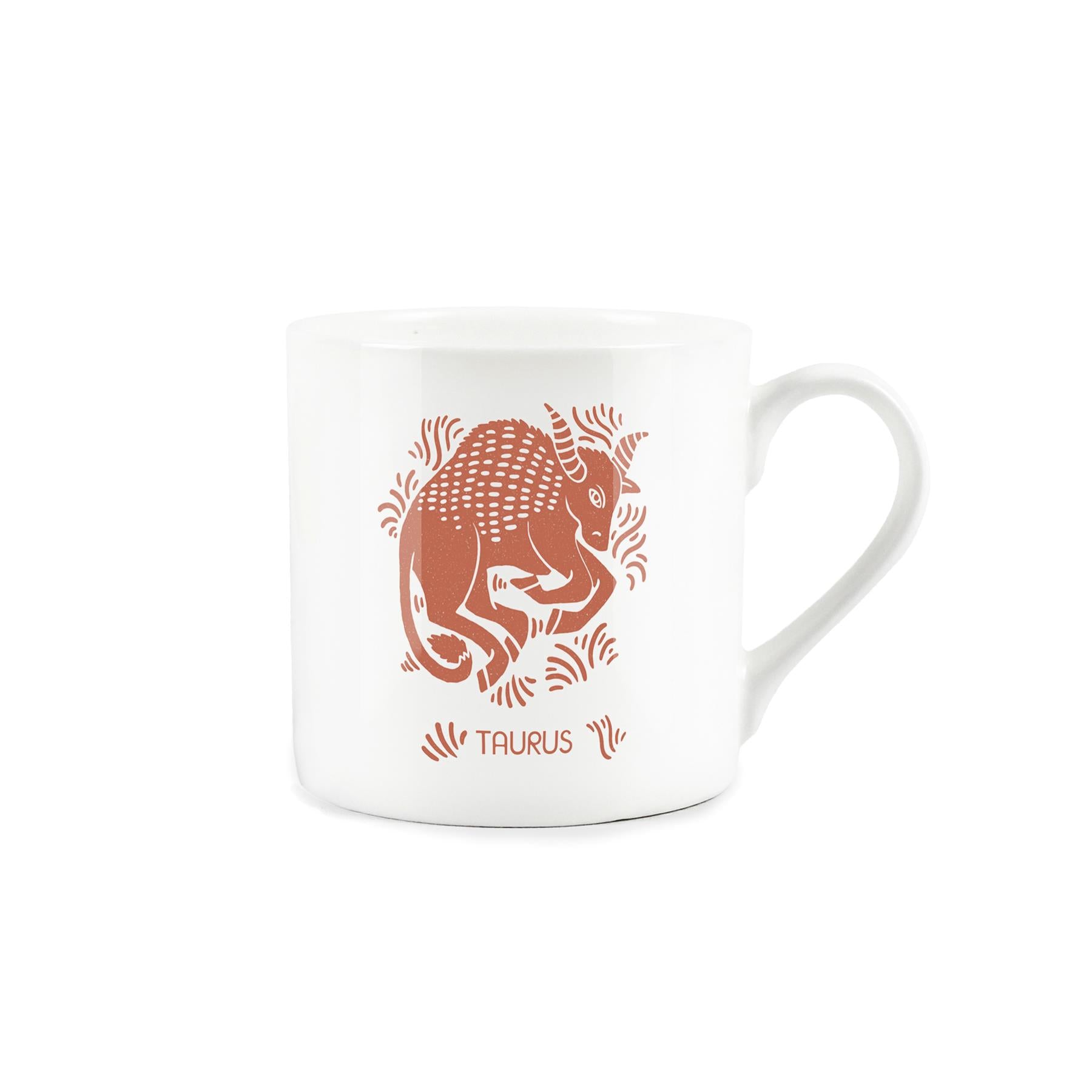 White bone china mug with orange taurus print design