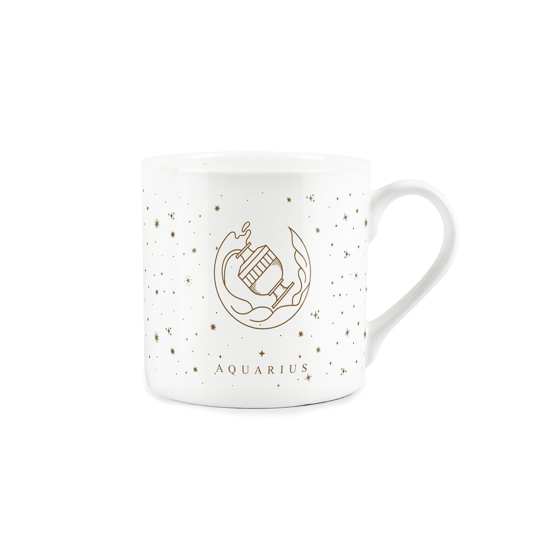 A white mug adorned with a golden zodiac design: aquarius