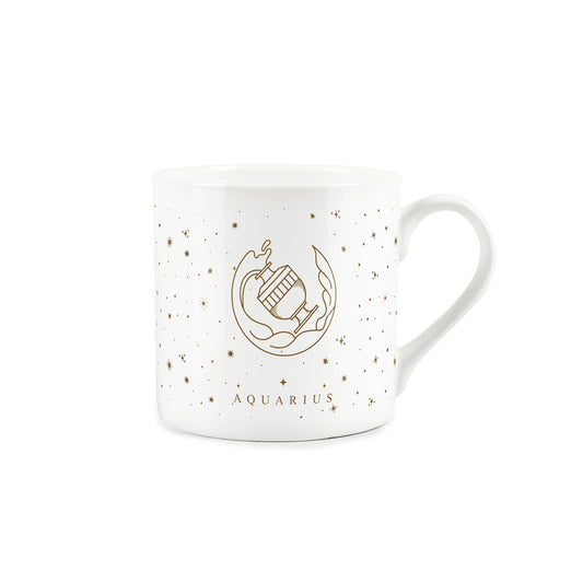 A white mug adorned with a golden zodiac design: aquarius