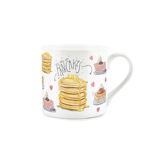A mug with a stack of pancakes on it, ready to be enjoyed with a drizzle of syrup. Featuring the message 'Life's better with pancakes'.
