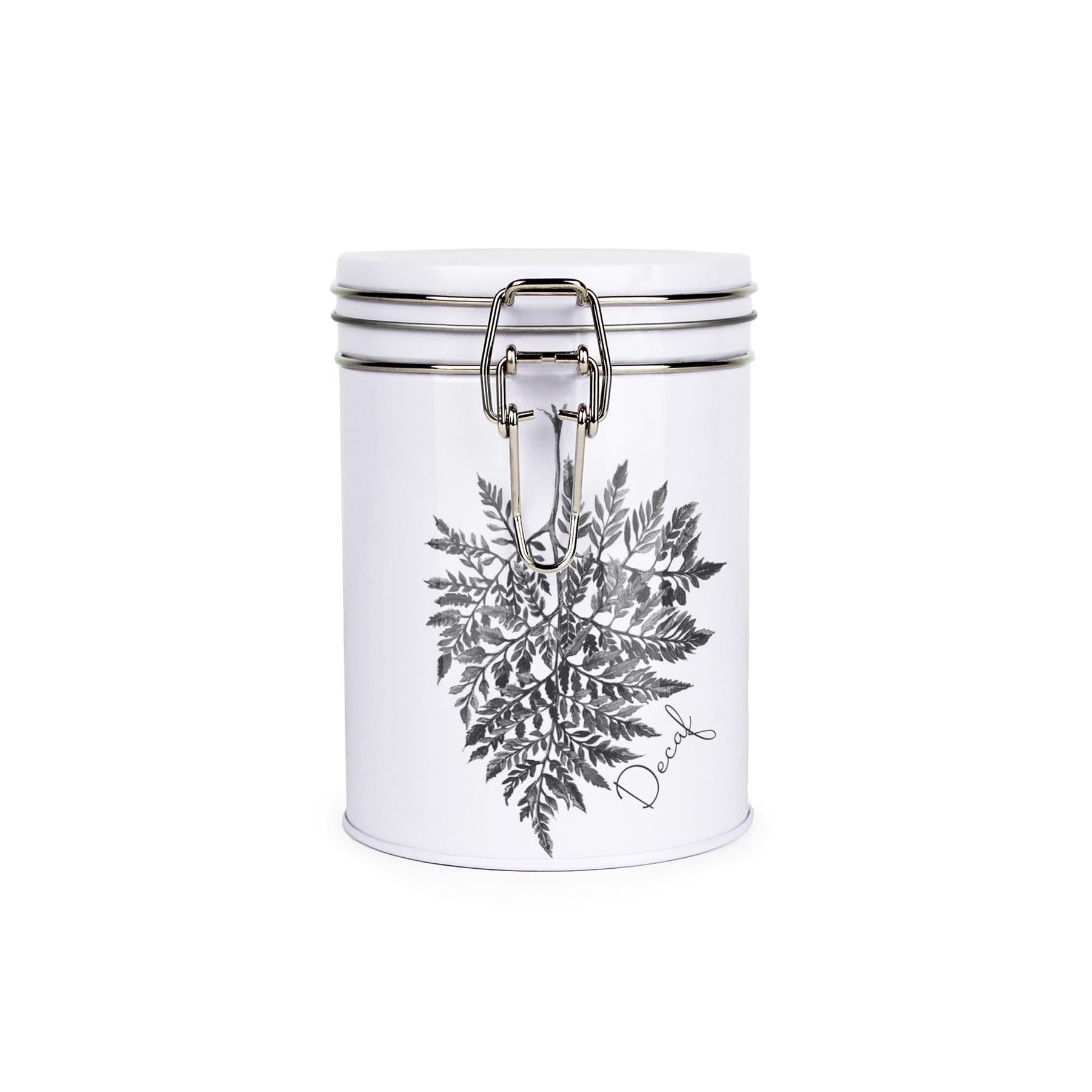 Tin metal storage canister with metal clip and lid featuring a black and white leaf design by Rhiannon Chauncey and decaf text