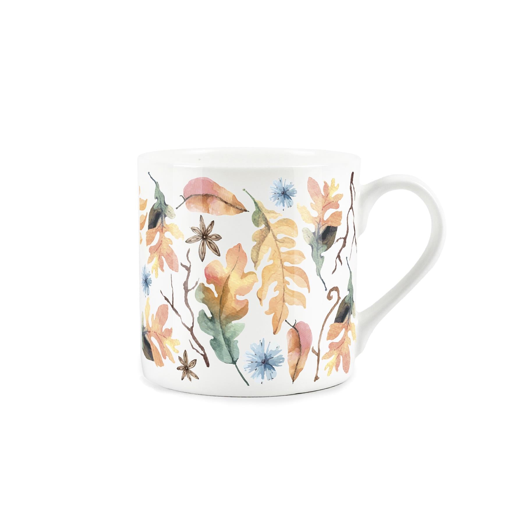 watercolour depiction of autumnal leaves, seed, and flowers on a white bone china mug