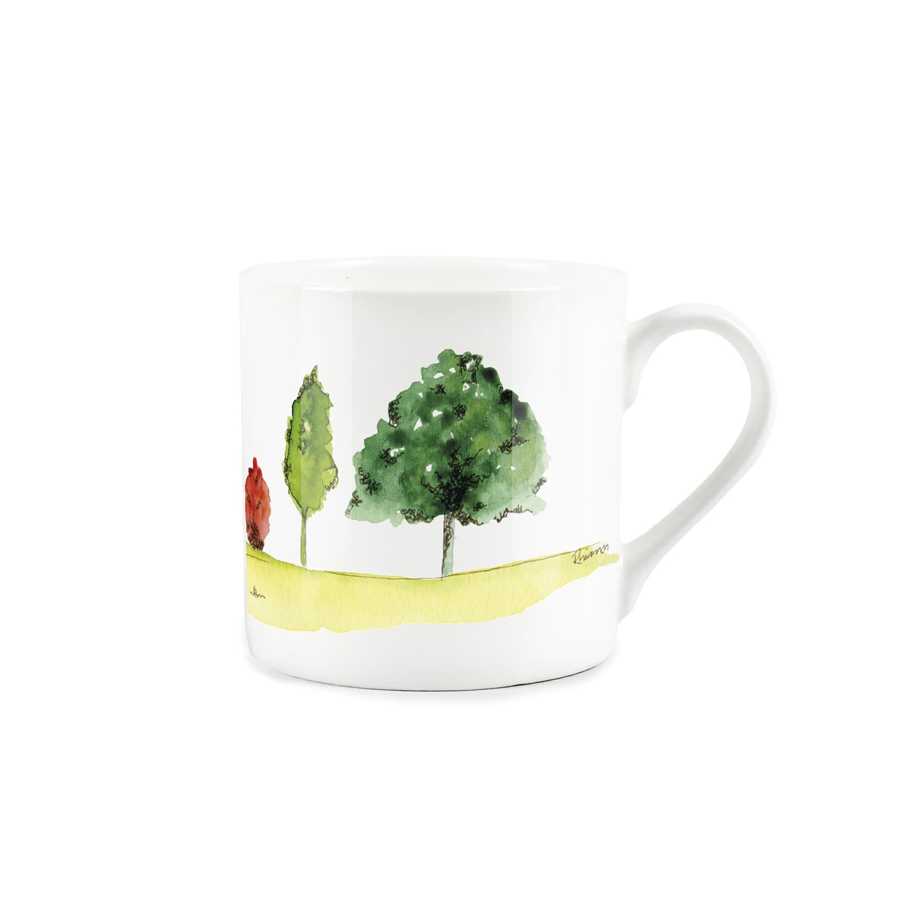 White bone china mug featuring a depiction of english landscapes by artist rhiannon chauncey