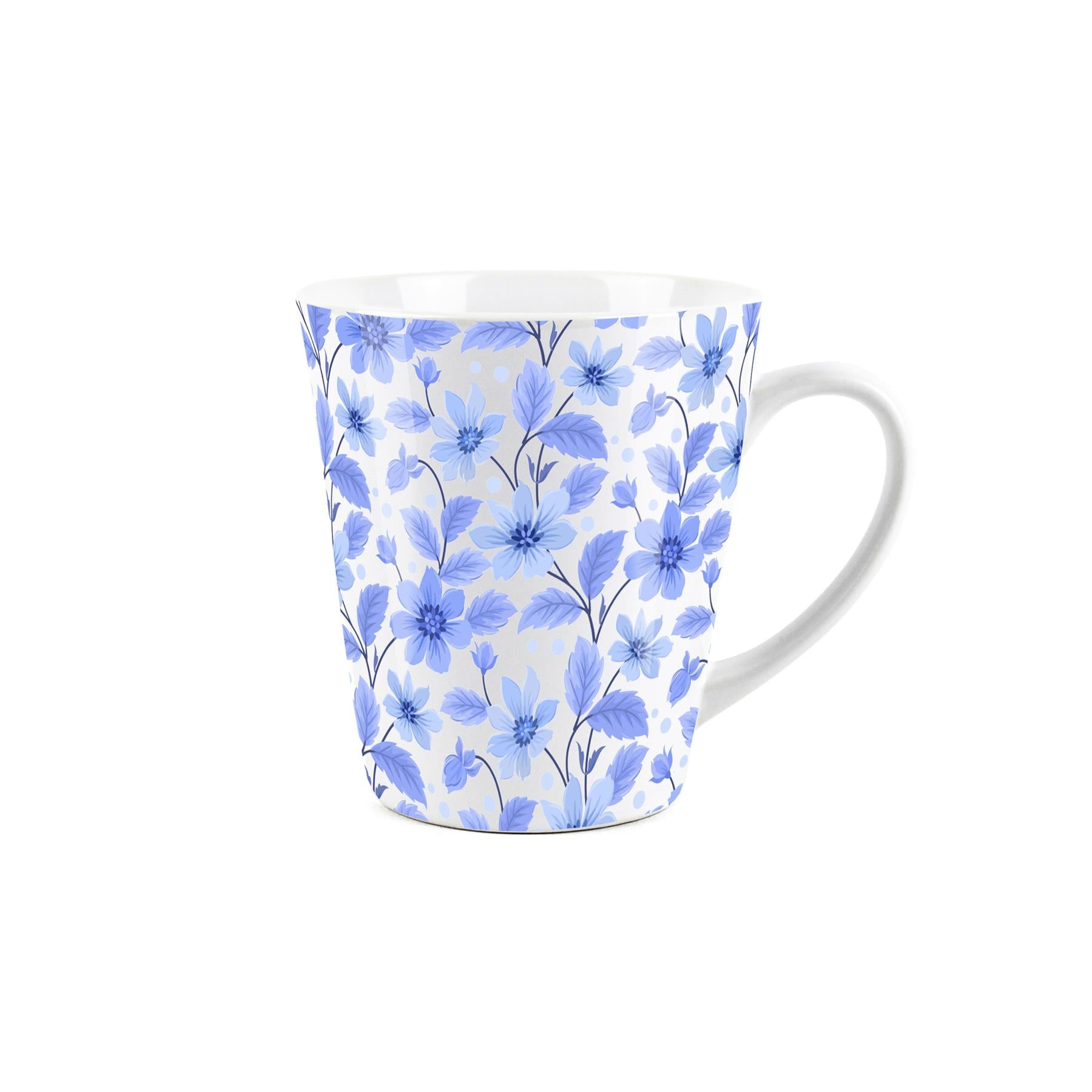 Small white latte mug featuring floral blue design