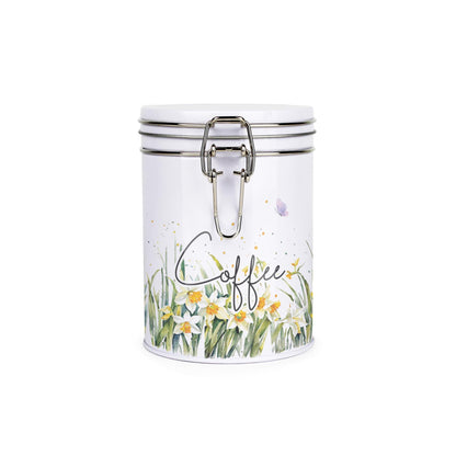 Metal canister with a metal clip and lid featuring a delicate daffodil print with butterflies and dragonflies and coffee text