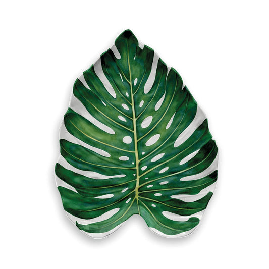 White melamine serving platter in the shape of a monsterra leaf featuring green printed depiction of a monsterra leaf onto the item 