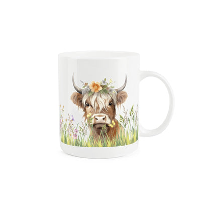 White bone china mug featuring adorable blonde-haired highland cow design with a floral crown. 