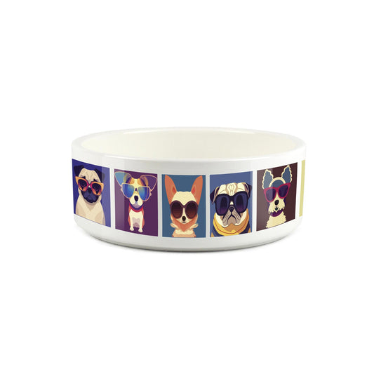 Small ceramic white pet bowl with pop art style dogs printed on surface. 