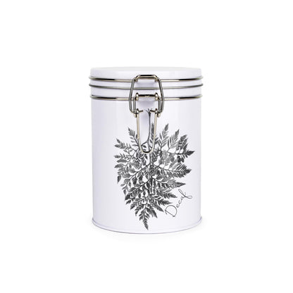 Tin metal storage canister with metal clip and lid featuring a black and white leaf design by Rhiannon Chauncey and decaf text