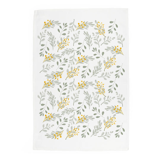 Muted illustrations of leaves printed onto an white panama cotton tea towel