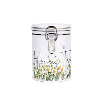 Metal canister with a metal clip and lid featuring a delicate daffodil print with butterflies and dragonflies and decaf tea text
