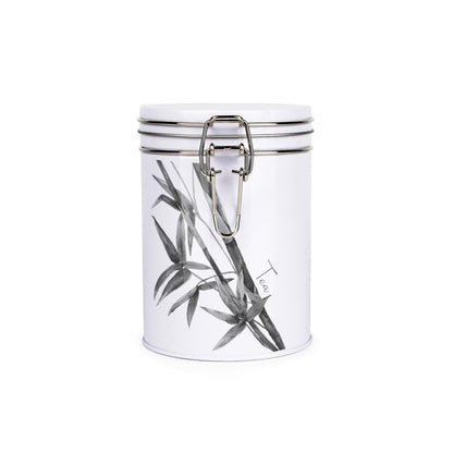 Tin metal storage canister with metal clip and lid featuring a black and white leaf design by Rhiannon Chauncey and tea text